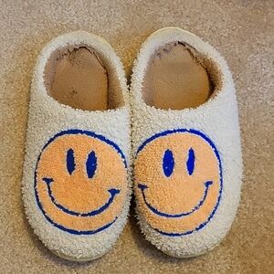 Free with any other purchase! Smiley Face Slippers fits size 7